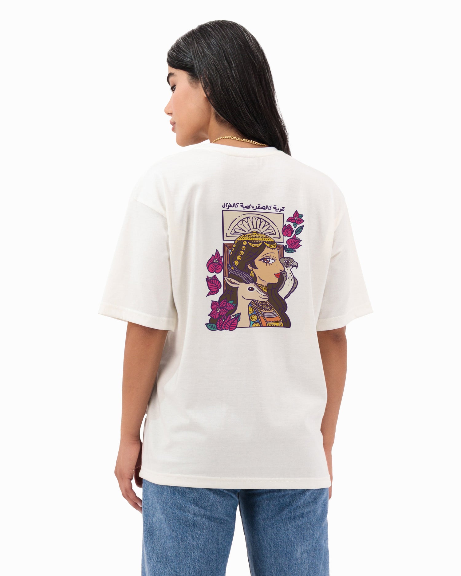 Person wearing a white t-shirt with a graphic design on the back, standing against a white background