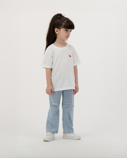 Kid wearing white Batikh T-Shirt with watermelon and fruit graphic.